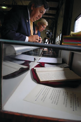 Visitors look at the logbook during the opening of The National Fire Heritage Center in Emmitsburg, Md.