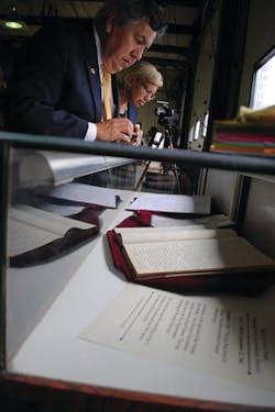 Visitors look at the logbook during the opening of The National Fire Heritage Center in Emmitsburg, Md. Visitors look at the logbook during the opening of The National Fire Heritage Center in Emmitsburg, Md.