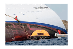 Italian firefighters approach the luxury cruise ship Costa Concordia, which ran aground off the tiny Tuscan island of Giglio, Italy, Sunday, Jan. 15, 2012. Italian firefighters approach the luxury cruise ship Costa Concordia, which ran aground off the tiny Tuscan island of Giglio, Italy, Sunday, Jan. 15, 2012.