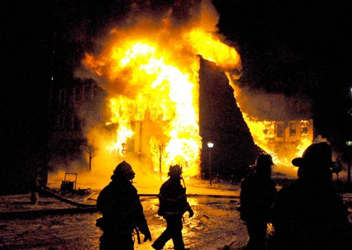 Beckley firefighters approach a burning building in the city's downtown.