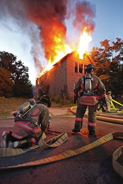 BUFFALO, NY, JULY 5, 2011 – Firefighters prepare to attack an early-morning working fire in a 2½-story wood-frame vacant building. Photo by John Hanley BUFFALO, NY, JULY 5, 2011 – Firefighters prepare to attack an early-morning working fire in a 2½-story wood-frame vacant building. Photo by John Hanley
