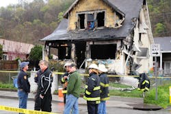 Mayor Danny Jones and Charleston, W.Va., firefighters look over the scene of a house fire on Saturday, March 24. Mayor Danny Jones and Charleston, W.Va., firefighters look over the scene of a house fire on Saturday, March 24.