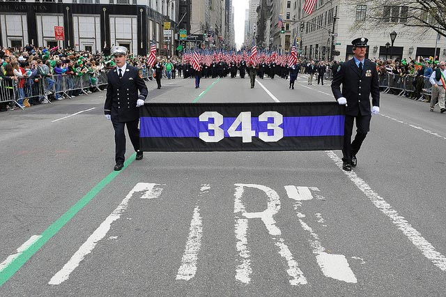 FDNY members carry 343 flags in the St. Patrick's Day Parade.