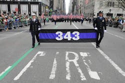 FDNY members carry 343 flags in the St. Patrick's Day Parade. FDNY members carry 343 flags in the St. Patrick's Day Parade.