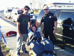 Chief Horton poses with the Holmquist family shortly after delivering the newest member.