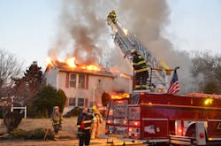 Crews position a ladder at a New Jersey house fire. Crews position a ladder at a New Jersey house fire.