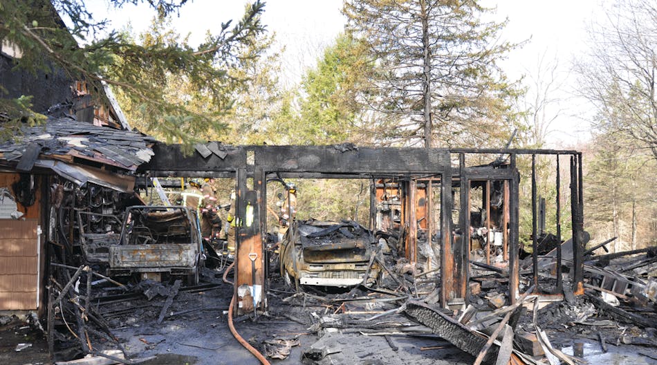 Overview of fire scene in Barkhamstead, CT, showing a Suzuki Samurai in the left bay and a Chevrolet Volt in right bay.