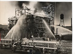 A five-alarm fire broke out in a 60-foot-high coal tipple containing 300 tons of coal at the Pennsylvania Railroad's Orangeville Yard in Baltimore, MD, on Feb. 23, 1936. A five-alarm fire broke out in a 60-foot-high coal tipple containing 300 tons of coal at the Pennsylvania Railroad's Orangeville Yard in Baltimore, MD, on Feb. 23, 1936.