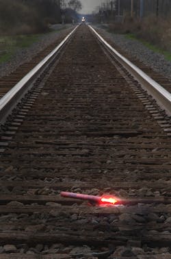 A fuse should be placed on the track at least a mile from the scene.