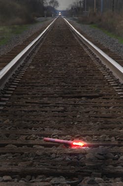 A fuse should be placed on the track at least a mile from the scene. A fuse should be placed on the track at least a mile from the scene.