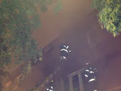 Baltimore firefighters ventilate the front third-floor during a fire at a house on West Lexington Street where three children were rescued on May 6. Baltimore firefighters ventilate the front third-floor during a fire at a house on West Lexington Street where three children were rescued on May 6.