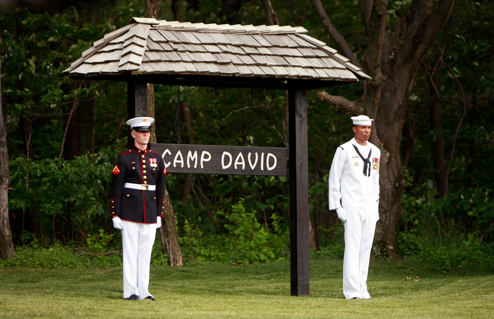 Members of an honor guard stand at attention at Camp David, Md. on June 26, 2008.