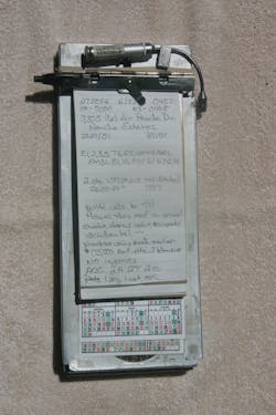 A reporter’s notebook on a 'citation holder.' Notice the pen, mini light for darkness and rubber band on the bottom of the notebook. A reporter’s notebook on a 'citation holder.' Notice the pen, mini light for darkness and rubber band on the bottom of the notebook.