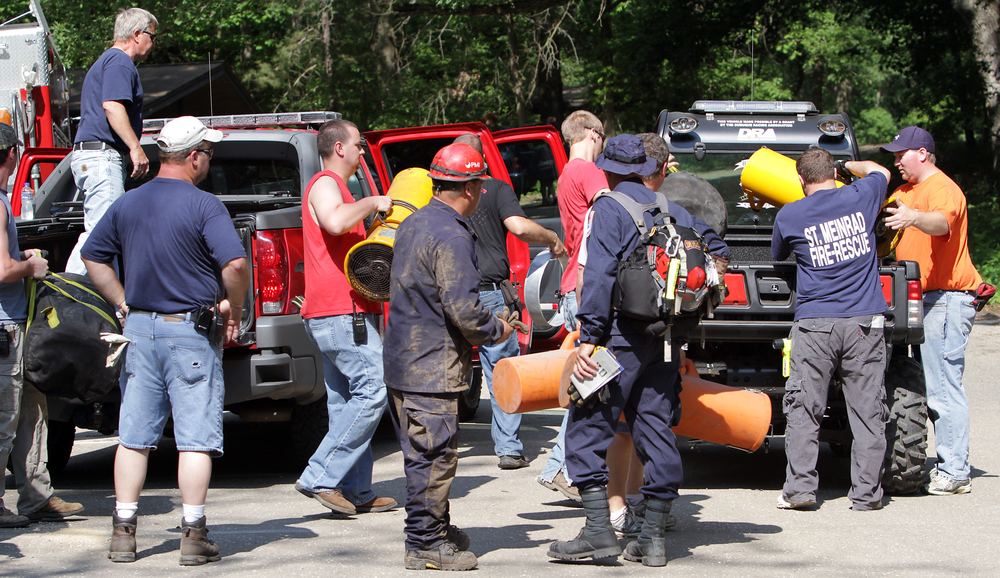 Emergency crews work at the scene at Maquoketa Caves State Park during an effort to free a man trapped overnight in a cave on May 19.