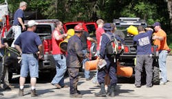 Emergency crews work at the scene at Maquoketa Caves State Park during an effort to free a man trapped overnight in a cave on May 19. Emergency crews work at the scene at Maquoketa Caves State Park during an effort to free a man trapped overnight in a cave on May 19.