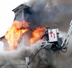 A stubborn, smoky fire severely damaged a Victorian home and attached stable in Manchester, N.H. on May 21 and temporarily trapped six firefighters during a ceiling collapse. A stubborn, smoky fire severely damaged a Victorian home and attached stable in Manchester, N.H. on May 21 and temporarily trapped six firefighters during a ceiling collapse.