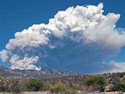 A plume of smoke is seen rising from the Whitewater fire burning in the Gila Wilderness east of Glenwood, N.M. on May 22.