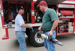 Kremlin Firefighter Chris Henry, left and Fire Chief Derrick Harris check out hydraulic extrication tools used to free two teens following a grain auger accident last August. Kremlin Firefighter Chris Henry, left and Fire Chief Derrick Harris check out hydraulic extrication tools used to free two teens following a grain auger accident last August.