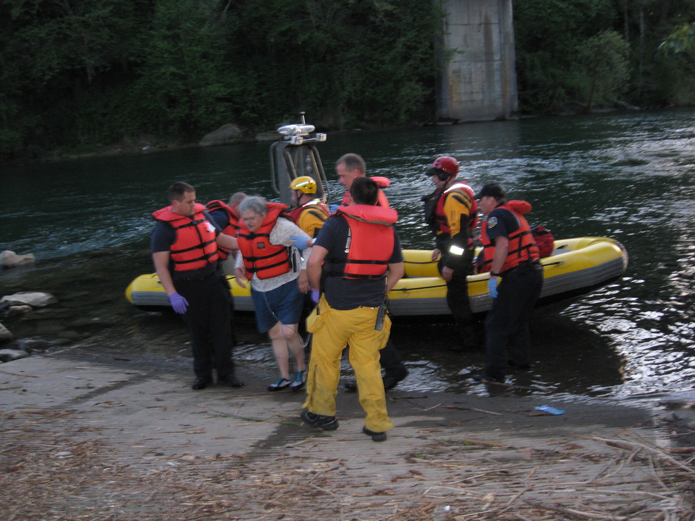 Three adults were rescued from the Clackamas River late Saturday after their inflatable raft capsized.