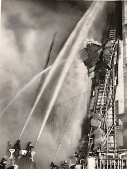 Firefighters attack a seven-alarm fire in downtown Baltimore, MD, on May 9, 1938. Firefighters attack a seven-alarm fire in downtown Baltimore, MD, on May 9, 1938.