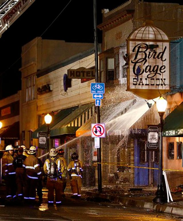 Firefighters put out a fire at the Bird Cage Saloon on historic Whiskey Row in Prescott, Ariz. on May 8.