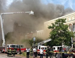 Baltimore firefighters battled a five-alarm blaze at a vacant warehouse in Fells Point Monday afternoon.