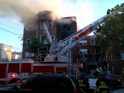 At least four people were injured and others were rescued down ladders when an extra-alarm blaze broke out at a courtyard apartment building in the Chatham neighborhood in Chicago on June 26.