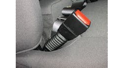 The presence of an accordian-looking sleeve below the seatbelt buckle is a good indicator that the seatbelt pretensioner system is located just below this buckle.