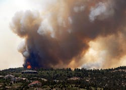 Smoke billows from a wildfire west of Colorado Springs, Colo. on June 23. Smoke billows from a wildfire west of Colorado Springs, Colo. on June 23.