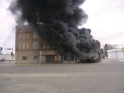The original fire building, the North Star Building, is right in the view of side A. The exposure at left is the vacant former Elks Building. The photo was taken nine minutes after dispatch.