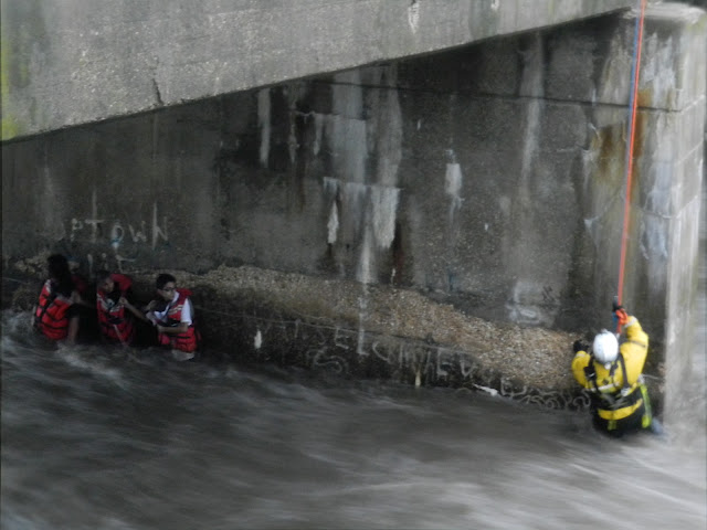 Amid the heavy rains that swept through the area on Friday, Prince George's County firefighters rescued three teens from the swollen Northwest Branch waterway.