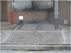 Photo 1. Bulkhead doors can be found at various levels of the building. Here it is built right into the street. Photo 1. Bulkhead doors can be found at various levels of the building. Here it is built right into the street.