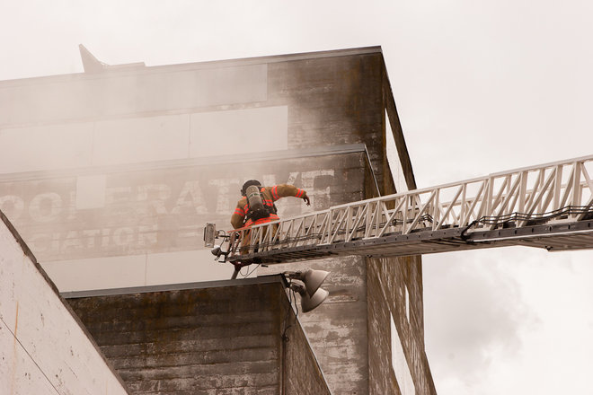 Firefighters battle a fire at a warehouse in Southeast Portland.