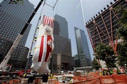 FDNY&apos;s Ladder Company 3 fire truck is lowered by crane into the National September 11 Museum on July 20, 2011.