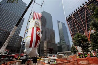 FDNY&apos;s Ladder Company 3 fire truck is lowered by crane into the National September 11 Museum on July 20, 2011.