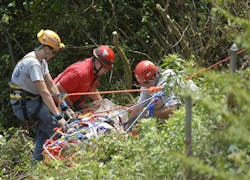 Cody Odom, left, and Patrick Halstead, right, of Walden's Ridge Emergency Services, and Lt. Stuart Ball, center, of Hamilton County Emergency Services lift Mark Bush up over a bluff. Cody Odom, left, and Patrick Halstead, right, of Walden's Ridge Emergency Services, and Lt. Stuart Ball, center, of Hamilton County Emergency Services lift Mark Bush up over a bluff.