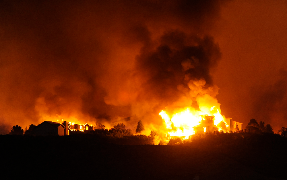 Homes are destroyed by the Waldo Canyon fire in the Mountain Shadows area of Colorado Springs on June 26.