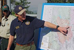 Incident Commander Rich Harvey uses a map as he talks about the Waldo Canyon wildfire during a briefing in Colorado Springs, Colo. on June 27.