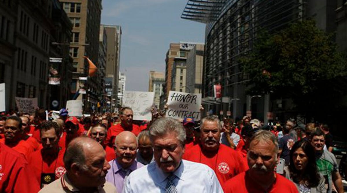 Firefighters assemble with Harold Schaitberger, IAFF general president, and march to City Hall in Philadelphia on July 26.