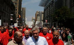 Firefighters assemble with Harold Schaitberger, IAFF general president, and march to City Hall in Philadelphia on July 26. Firefighters assemble with Harold Schaitberger, IAFF general president, and march to City Hall in Philadelphia on July 26.