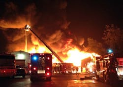 Firefighters battle a five-alarm blaze at an old mill complex in Charlton, Mass. on July 26. Firefighters battle a five-alarm blaze at an old mill complex in Charlton, Mass. on July 26.