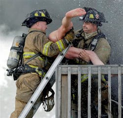 Racine firefighters rescue Pete Lui from the balcony of his burning home on July 24.