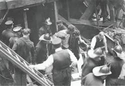 NEW YORK CITY, MAY 24, 1924 &ndash; Members of FDNY Ladder 4 and Rescue 1 help remove an injured worker after a cave-in occurred in the subway.