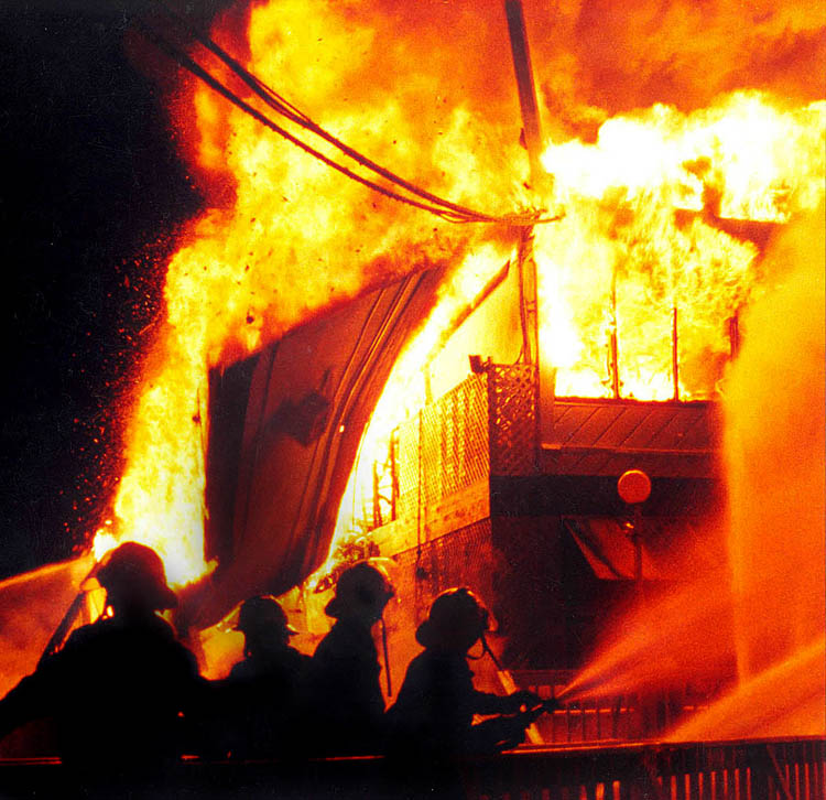 Fast-spreading fire tactics may dictate writing off the structures originally involved and focusing all resources on preventing the fire from spreading. Care must be taken to prevent lines and firefighters from being positioned in places where they could be endangered by collapsing buildings or other factors.