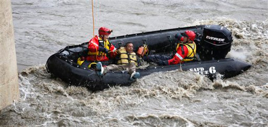 Santos Olivo is rescued by San Antonio firefighters on July 11.