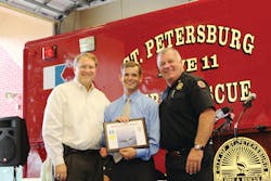 St. Petersburg Mayor Bill Foster (left) and Fire Chief James D. Large (right) presented the Heroic Citizen Award to Gus Hertz. St. Petersburg Mayor Bill Foster (left) and Fire Chief James D. Large (right) presented the Heroic Citizen Award to Gus Hertz.