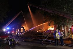 St. Louis firefighters pour water on to a fire in a vacant warehouse on July 26.