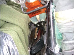 Photo 1. Disentanglement of this patient&apos;s arm (below the tips of the tool) from the wreckage needs to be done before the victim can be extricated.