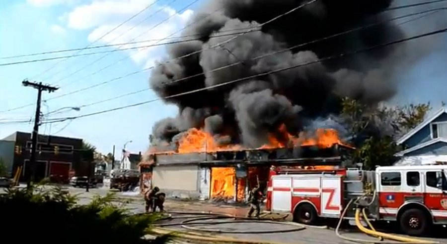 Buffalo firefighters battled a blaze at a auto repair shop and a Chinese restaurant directly across the street from a firehouse on Aug. 25.