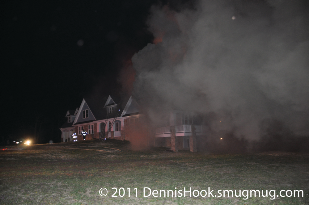 Chief 6C arrived on scene and reported moderate, dark smoke with little to no velocity was coming from the eaves of the second floor gable ends in the area of the Side Alpha/Delta corner, but no fire was observed.